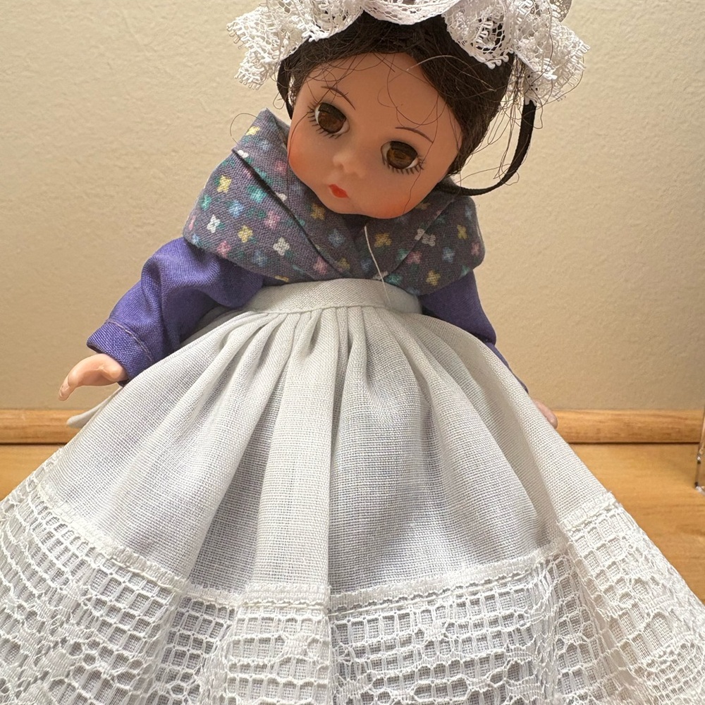 Adorable Doll with Purple and White Dress